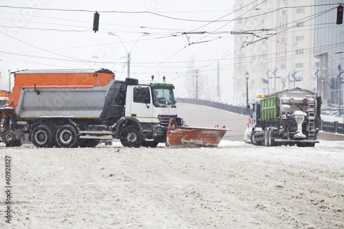 Snow trucks streets of a big city