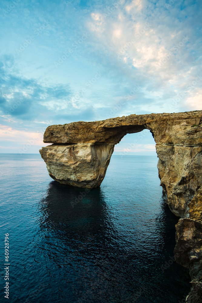 Azure Window, natural arch on Gozo island, with dramatic sky