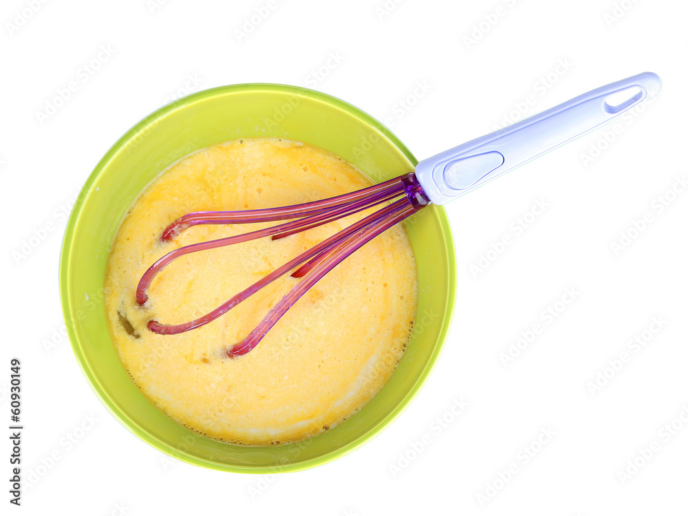 Corolla and broken eggs in bowl isolated on white Corolla and broken eggs in bowl isolated on white