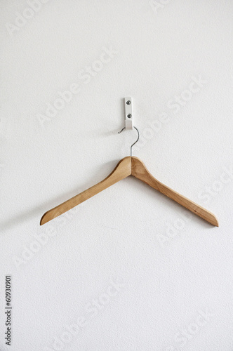 coat hanger against a white wall