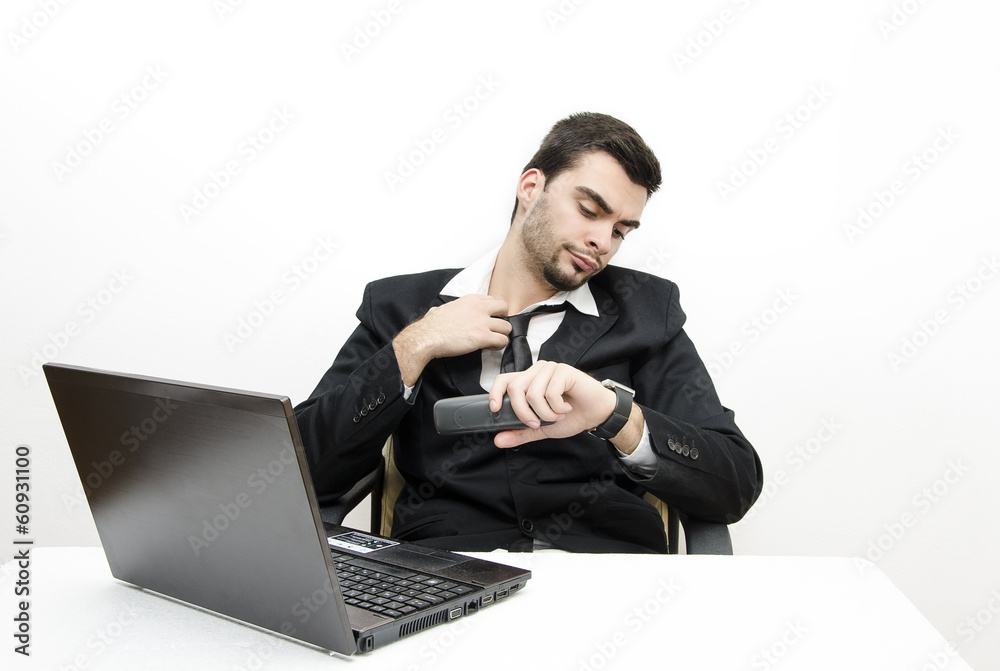 Young Businessman working late isolated on white Young Businessman working late isolated on white