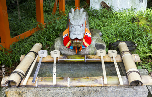 Canvas Print Purification ladles and a dragon statue in a shinto shrine in Ja