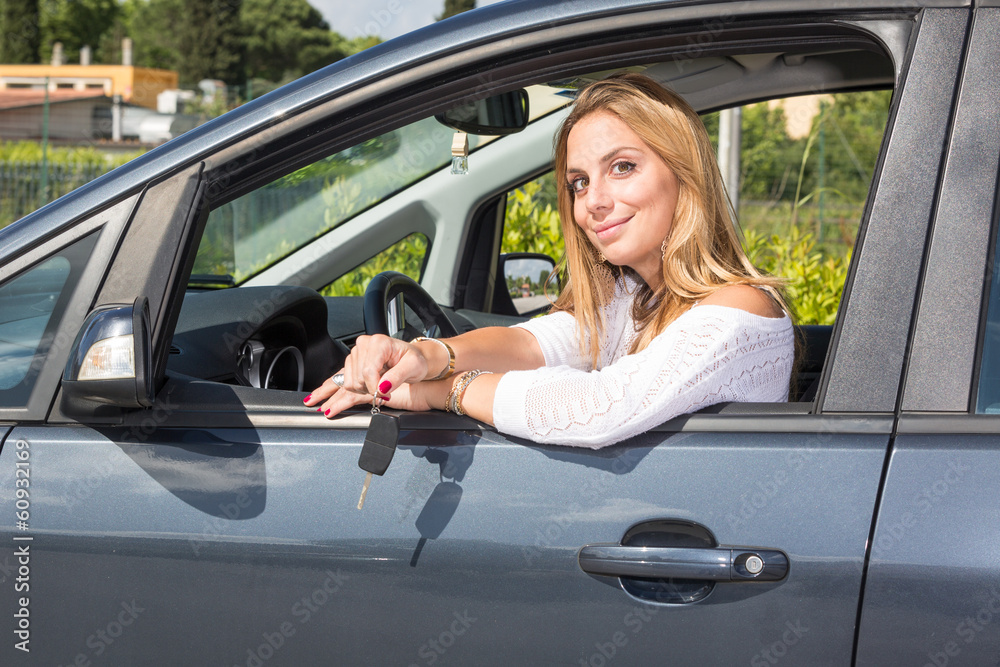 Happy Young Woman Showing Car Key
