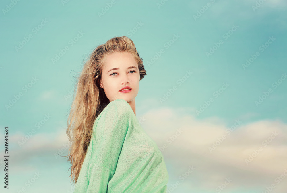 Young Blonde lady looking over her shoulder