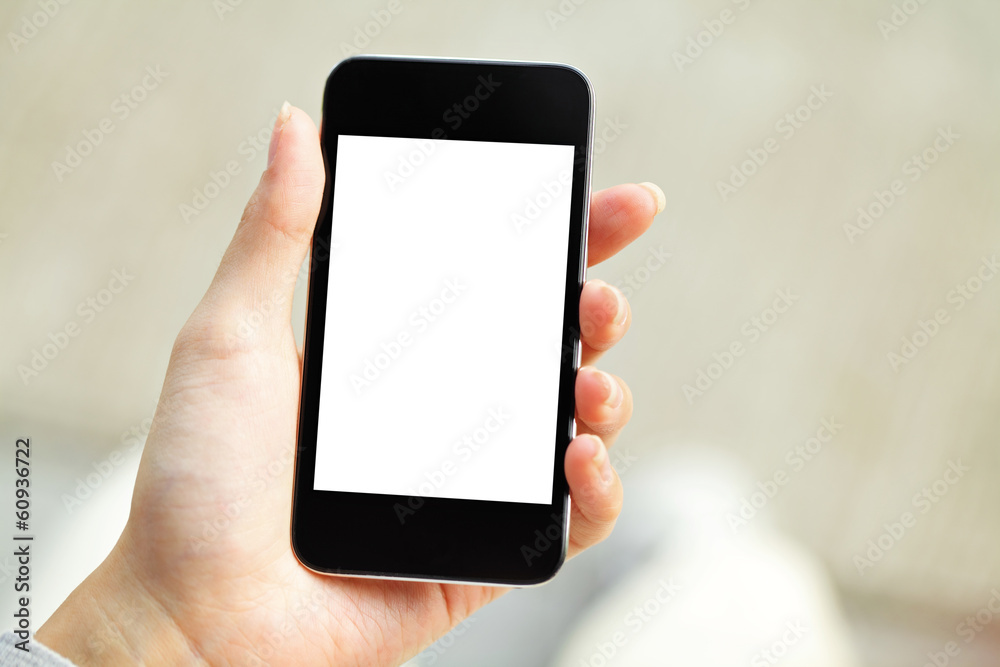 Hand holding mobile phone with blank screen Hand holding mobile phone with blank screen