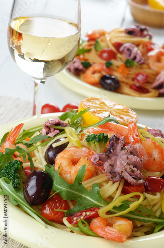 Seafood spaghetti pasta dish with octopus and shrimps