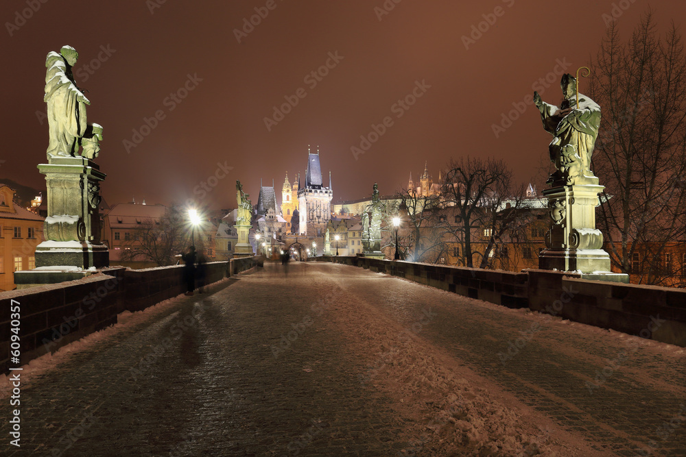 Fototapeta premium Night snowy Prague Castle with Sculptures from Charles Bridge
