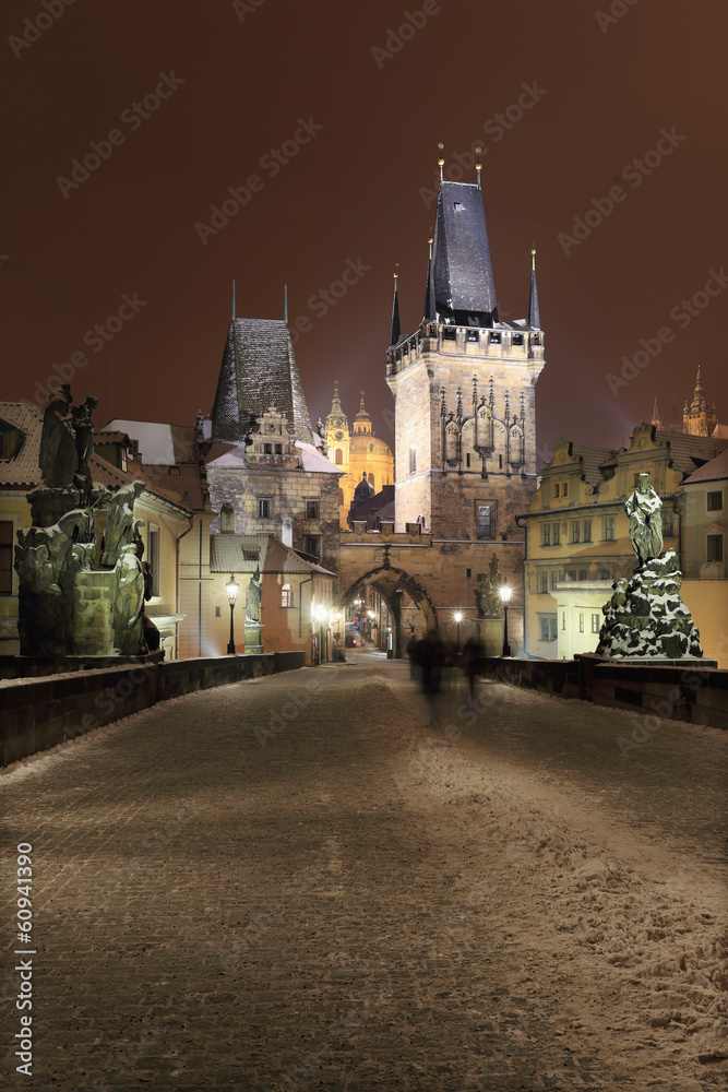 Night snowy Prague Charles Bridge and St. Nicholas' Cathedral