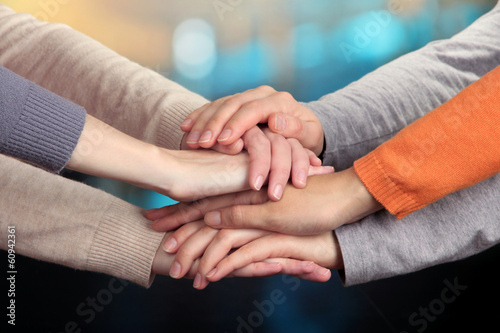 Human hands on bright background photo