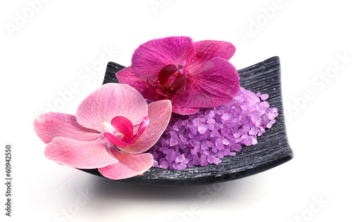 Beautiful blooming orchid flowers  and heap of sea salt