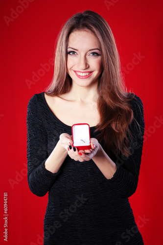 Girl looks at box with wedd...