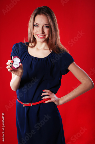 Girl looks at box with wedd...