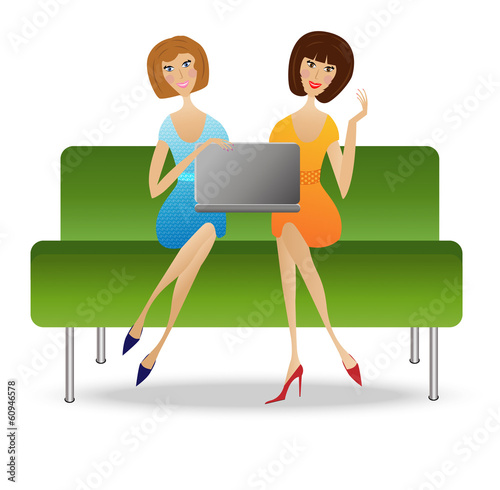 two young woman  with notebook sit on sofa photo