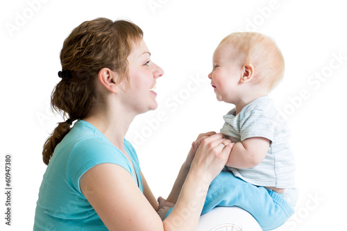 Happy mother having fun wit...