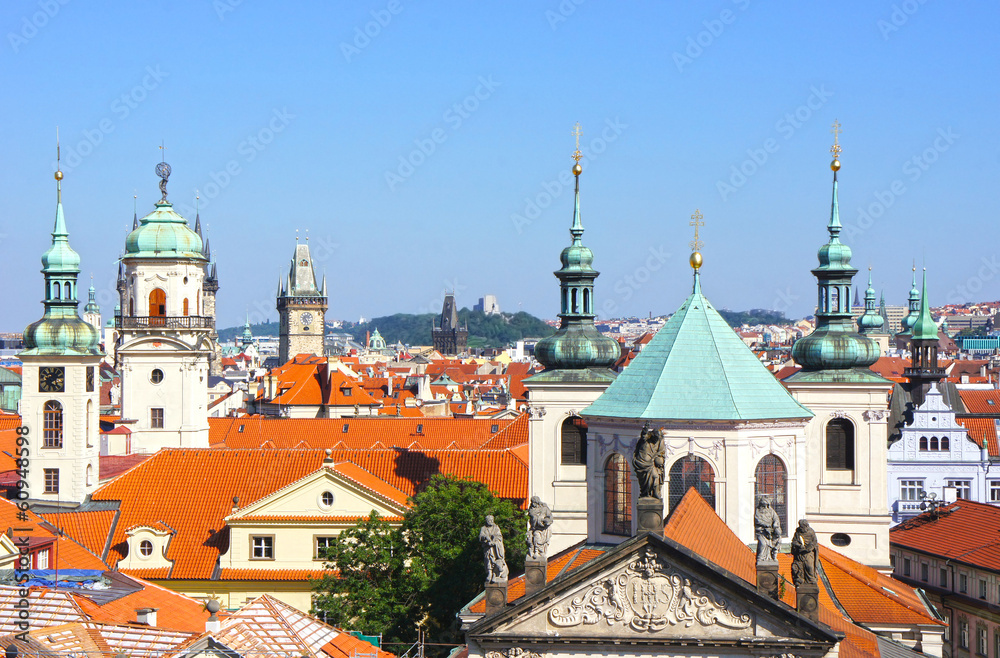 View from Prague: churches, towers and houses with red roofs