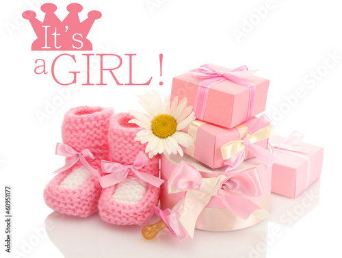 pink baby boots, pacifier, gifts and flower isolated on white © Africa Studio