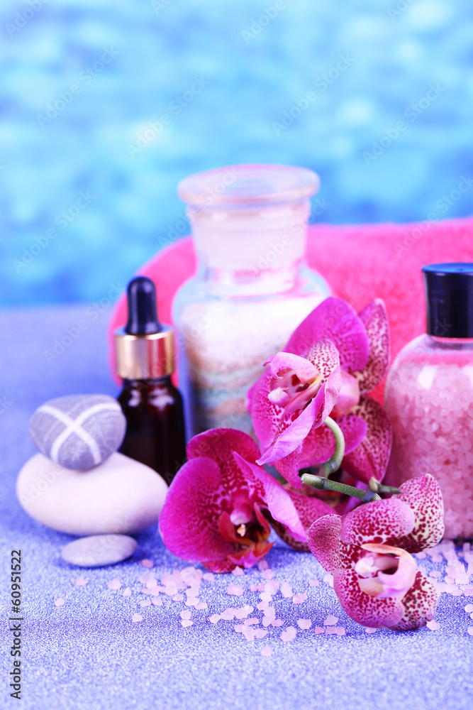 Beautiful spa setting with orchid on blue background Beautiful spa setting with orchid on blue background