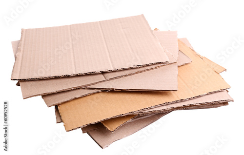 Stack of cardboard for recycling isolated on white photo