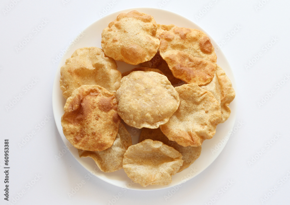 Indian breakfast poori (boori) in a plate with white background