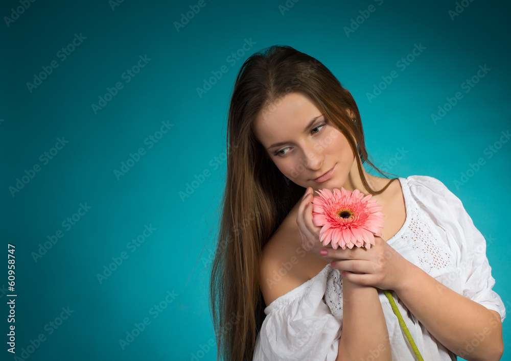 Attractive smiling woman portrait on blue background