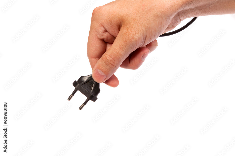 Man is holding a black outlet in the hand Man is holding a black outlet in the hand