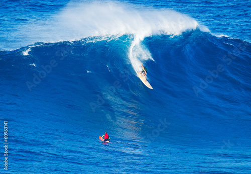 Surfer riding giant wave © EpicStockMedia