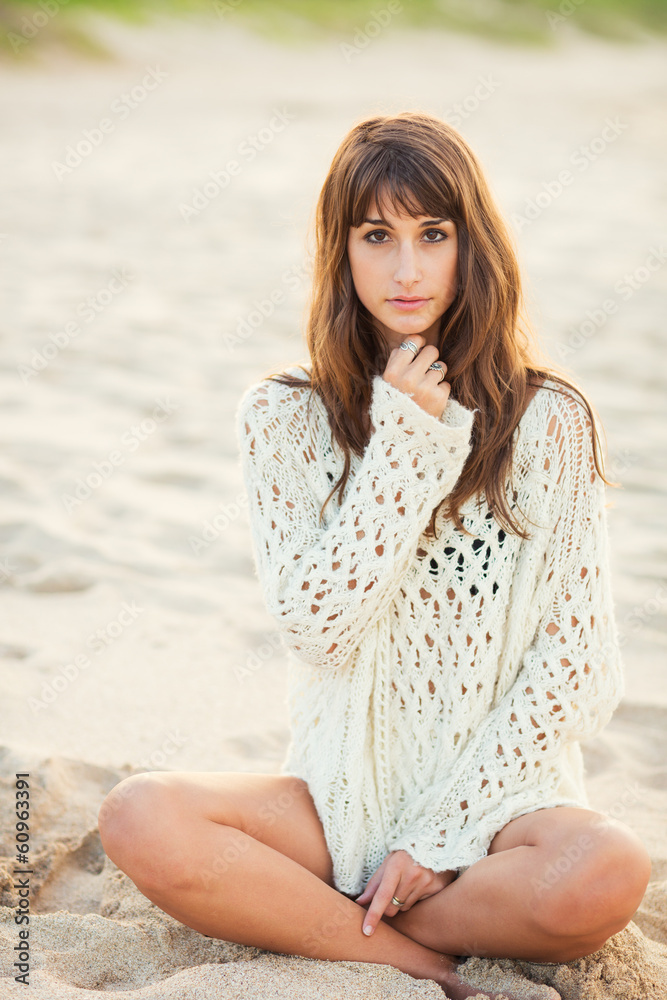 Fashion lifestyle, beautiful young woman on the beach at sunset Fashion lifestyle, beautiful young woman on the beach at sunset