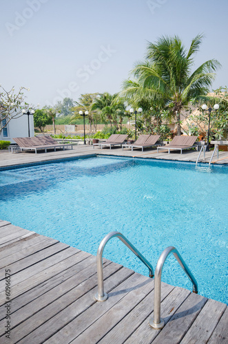 Swimming pool in tropical style resort © zmkstudio