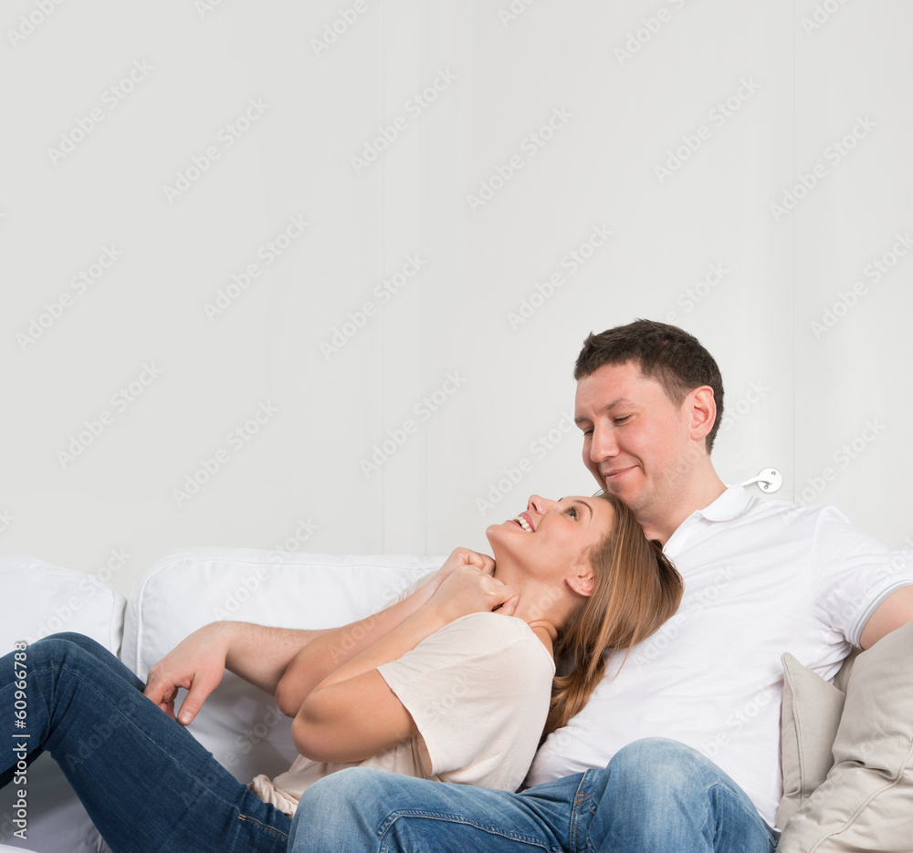 Young couple on the sofa in love Young couple on the sofa in love