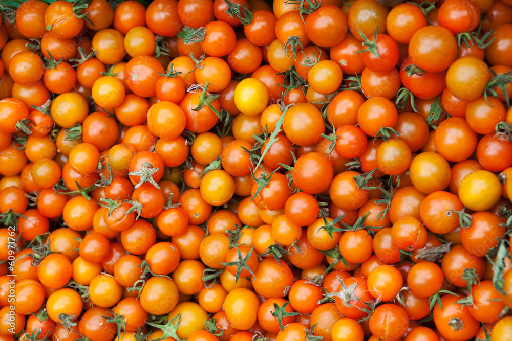 Bunch of yellow cherry tomatoes with selective focus Bunch of yellow cherry tomatoes with selective focus