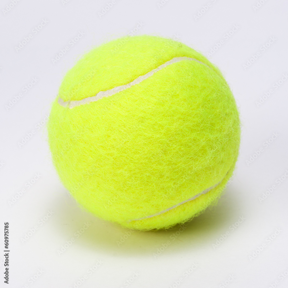 tennis ball isolated on a grey background
