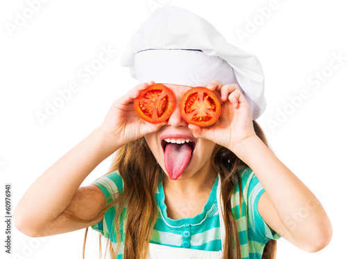 little girl with tomatoes