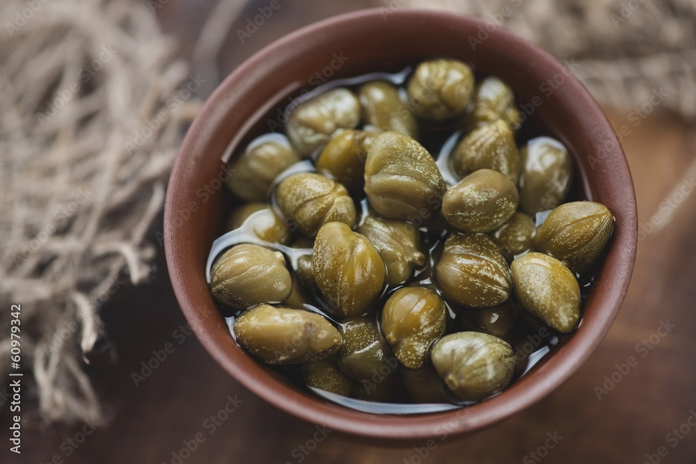 Above view of marinated capers, horizontal shot Above view of marinated capers, horizontal shot