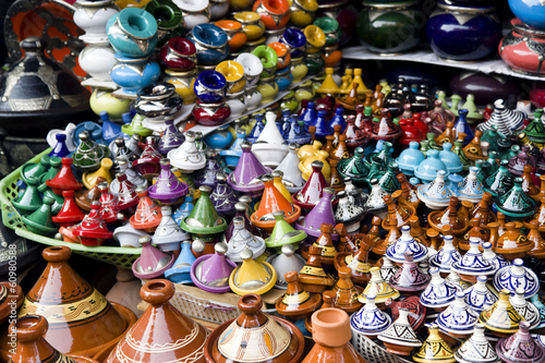 Many coloured tajines for sale in a market stall  Morocco