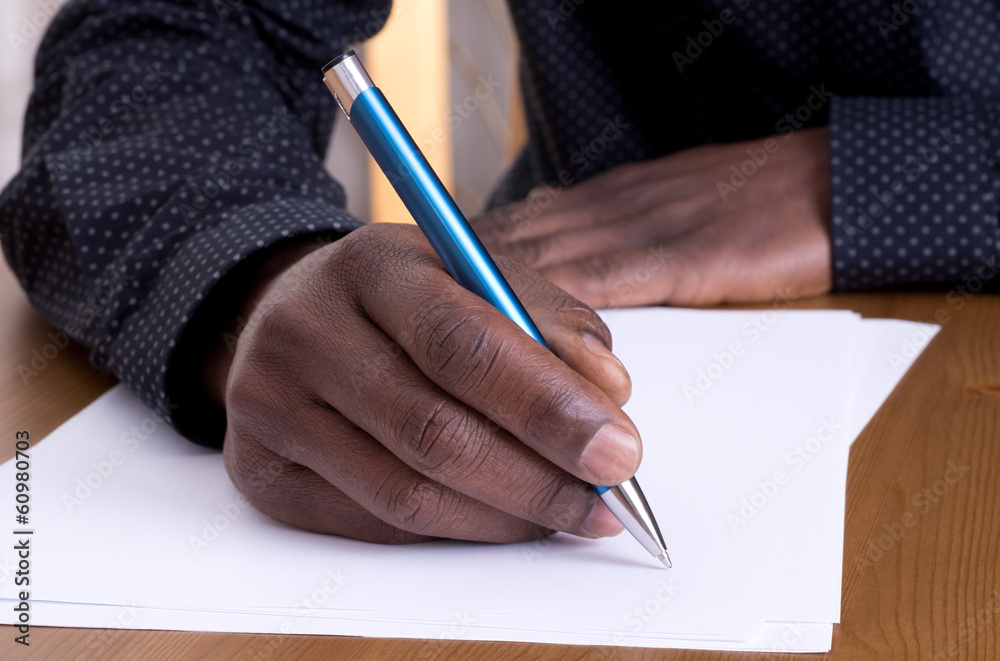 Fototapeta premium Man writing with a pen