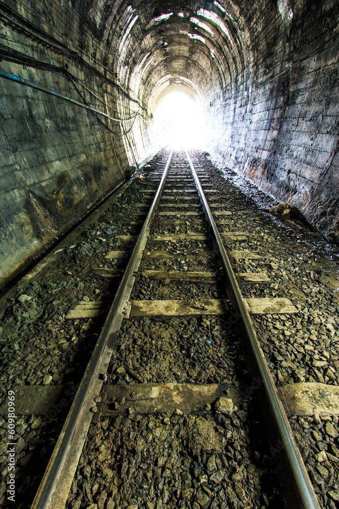 Fototapeta premium Light at the end of railroad tunnel