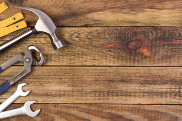 Tools on wooden background with copy space