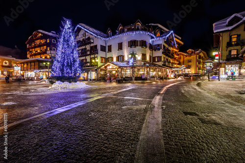 Fototapeta Naklejka Na Ścianę i Meble -  Illuminated Central Square of Madonna di Campiglio in the Evenin