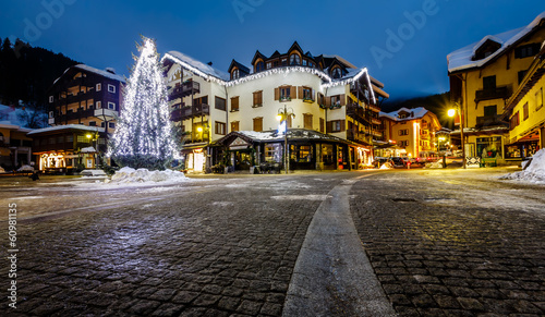Fototapeta Naklejka Na Ścianę i Meble -  Illuminated Central Square of Madonna di Campiglio in the Mornin