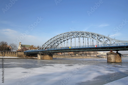 frozen Vistula river and bridge in Krakow, Poland photo