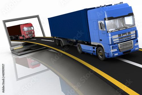 Trucks on freeway coming out of a laptop