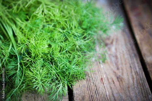 Fresh dill on rustic wooden table Fototapete