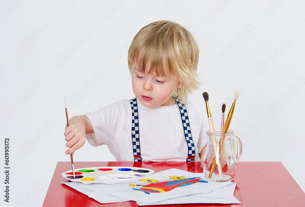Cute toddler drawing with colorful water painting Cute toddler drawing with colorful water painting