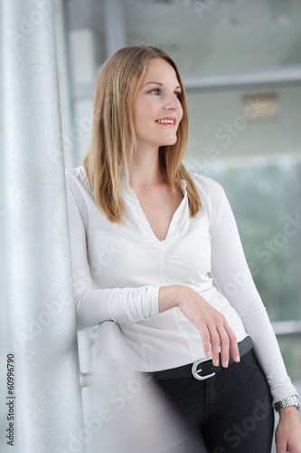 Businesswoman standing in a modern Building Free Download Businesswoman standing in a modern Building - GFXLoad