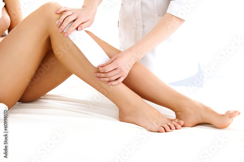 Well-groomed Woman Legs After Depilation Isolated on White Backg