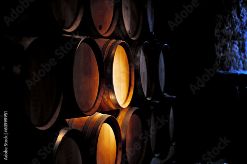 Canvas Print Barrel of wine in winery.