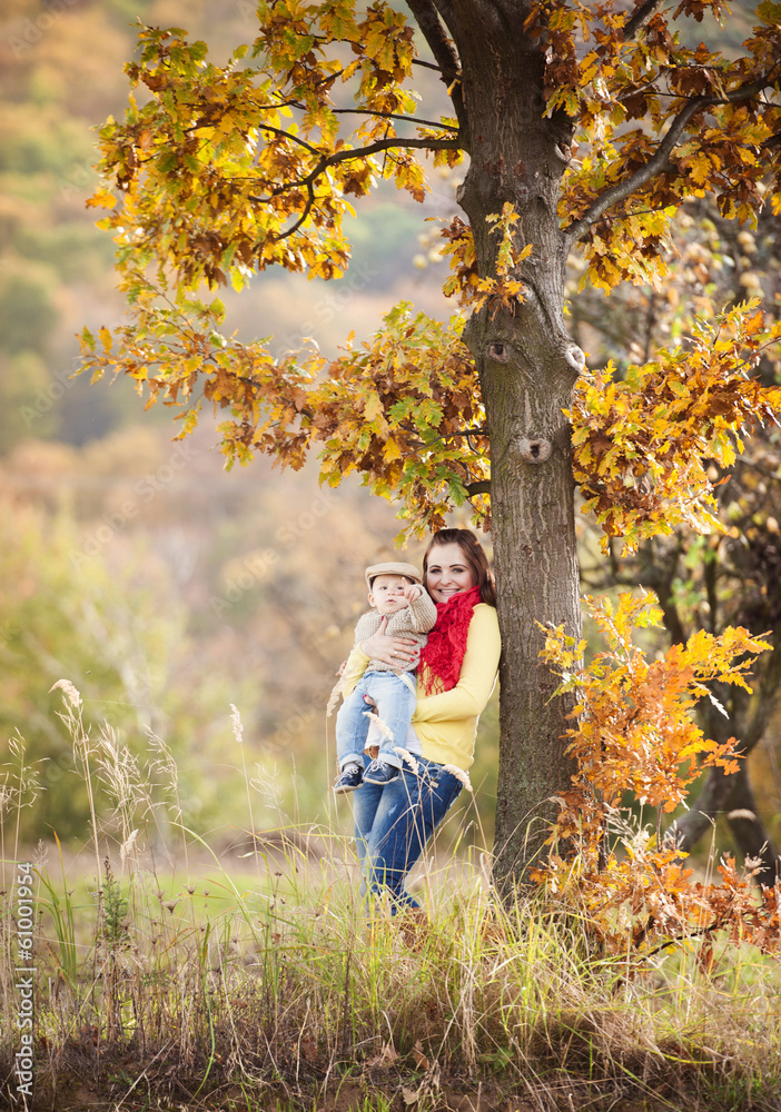 Family relaxing together in golden autumn nature Family relaxing together in golden autumn nature