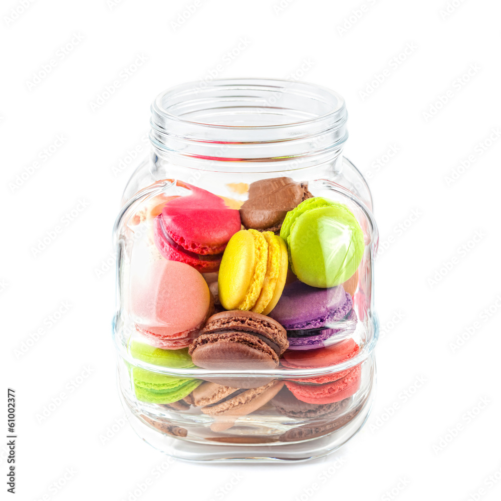 french colorful macarons in a glass jar