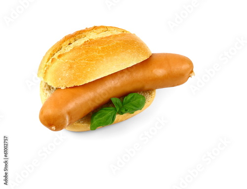 German sausage with bun and basil