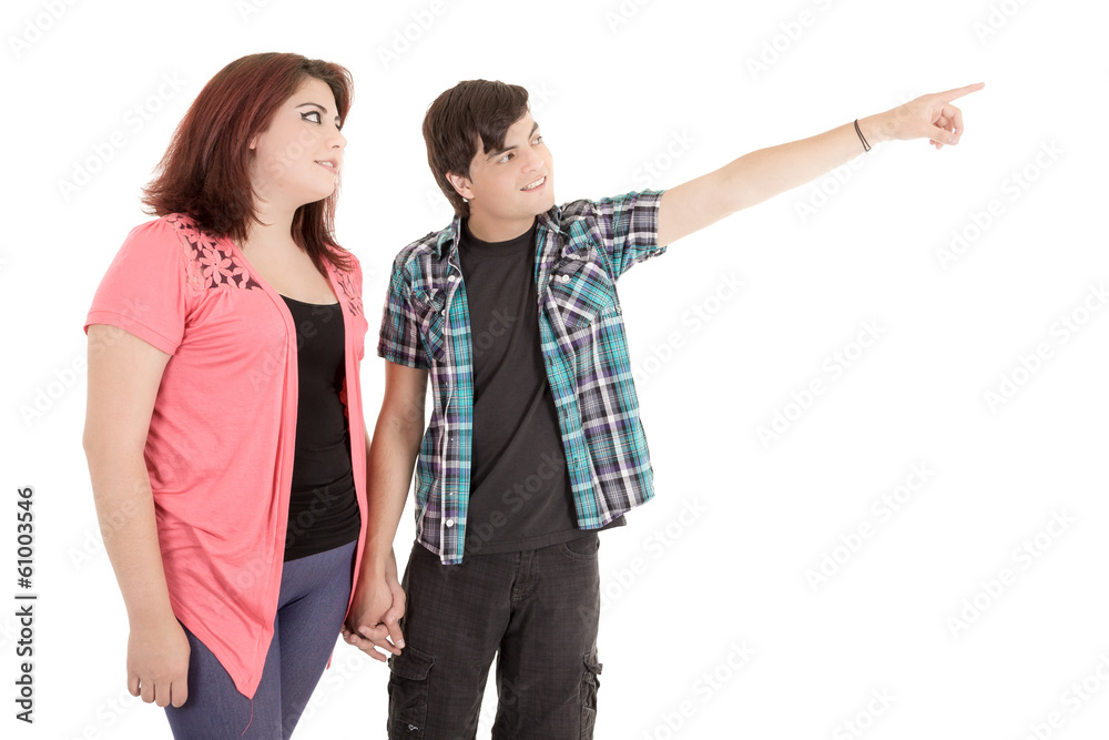 Fototapeta premium alternative young couple pointing finger to empty copy space